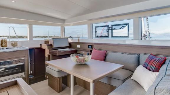 Cozy living area in Yacht Turtle with dining space and panoramic view, perfect for relaxation.