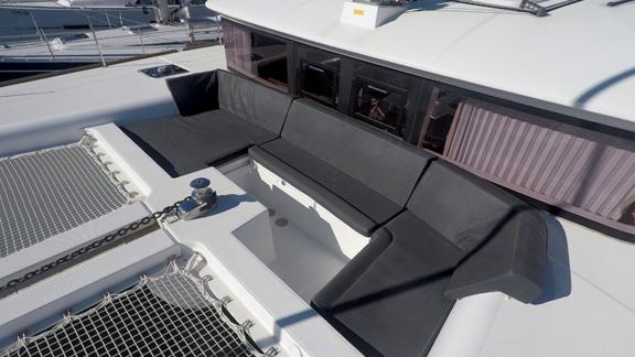 Comfortable lounging area on the foredeck of Zuzo 2, perfect for sunbathing and relaxation.