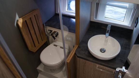 Among Saint Tropez yacht charter options Pegase motor yacht shows compact bathroom with sink and toilet.