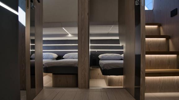 Among Saint Tropez yacht charter options Pegase motor yacht shows cabin with separate twin beds.