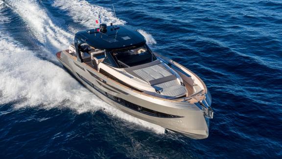 Among Saint Tropez daily yacht charter options Pegase motor yacht shows front deck sunbed and smooth cruising.