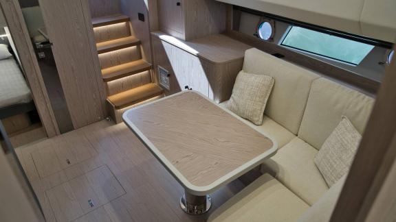 Among Saint Tropez yacht charter options Pegase motor yacht shows interior with seating and table for comfort.