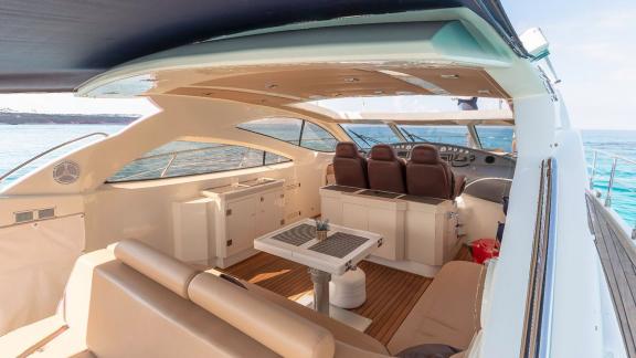 The spacious seating area of motor yacht Vida Boa stands out with comfortable seats and modern interior design.