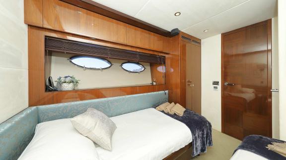 Comfortable cabin with a double bed and stylish details aboard the Motoryacht Agave in Split.