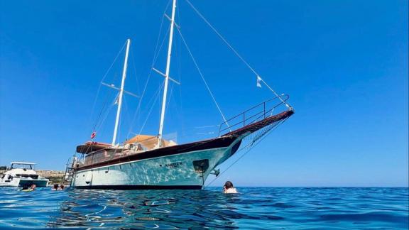 Enjoy a full day on the water near Rhodes with swim breaks aboard the 40-passenger Alexia K.