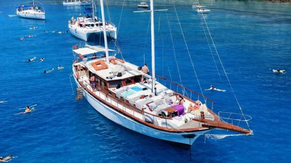 Enjoy a full-day cruise with swim breaks around Rhodes aboard the spacious Alexia K gulet.