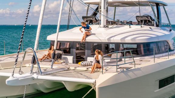 Guests enjoying the sun and relaxing on the luxurious Catamaran Daiquiri off the coast of Athens, Greece.