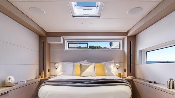 The spacious cabin on the Catamaran Daiquiri offers luxurious comfort with a large bed, panoramic windows, and a skyligh