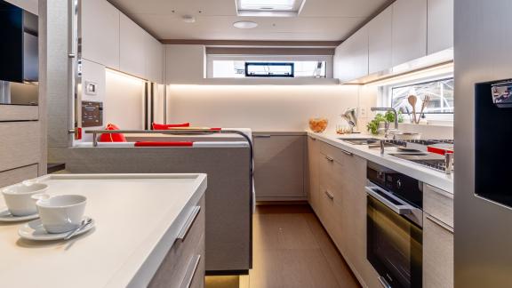 The well-appointed galley on the Catamaran Daiquiri offers modern comfort with high-end appliances and a cozy breakfast 