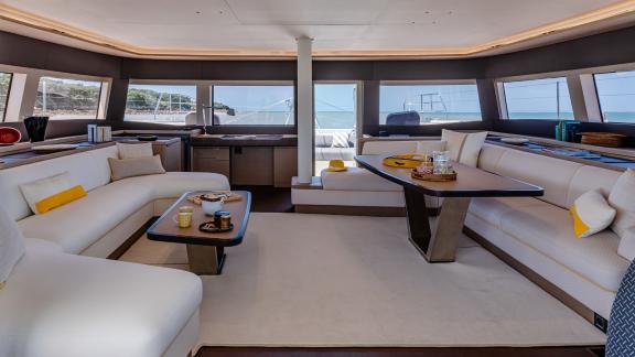 Luxurious salon on the Catamaran Daiquiri featuring spacious seating and panoramic windows offering stunning sea views.