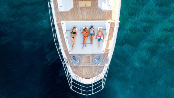 Guests enjoying the sun on the deck of the 27-meter motor yacht Dawo in Sibenik.