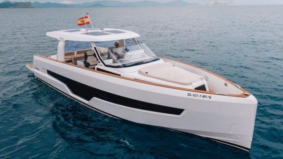 Among Nice day boat rental options, Coco is seen cruising across open waters.