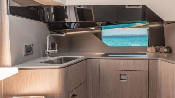 Among Nice private boat tour options, Coco is seen with a compact and modern galley area.