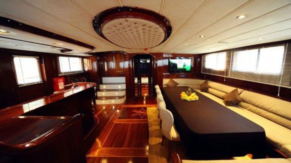 The elegant saloon of the gulet Dear Lila offers a stylish interior with dining area.