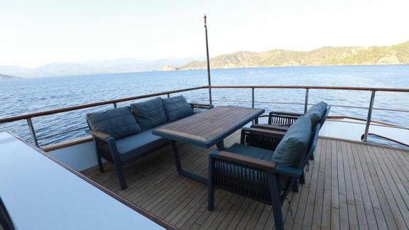 Comfortable seating area on the front upper deck of the trawler Nayk 3 anchored in Göcek.