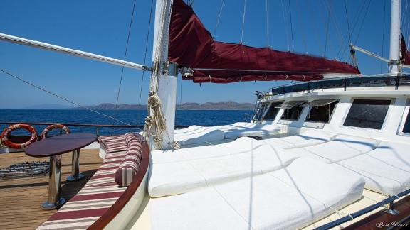 Sun deck of the gulet Vesta 1 Sevil, equipped with comfortable sunbathing areas and a view of the sea.