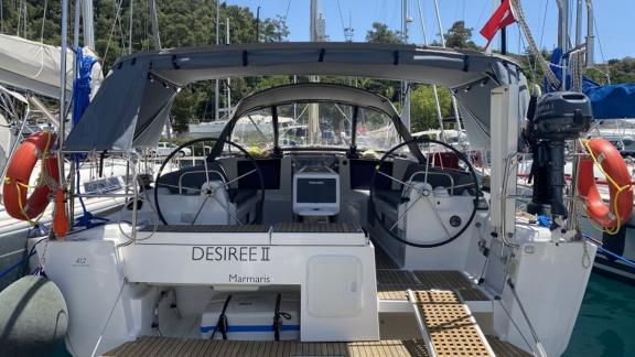 The stern of sailing yacht Desiree II is seen docked in the marina.