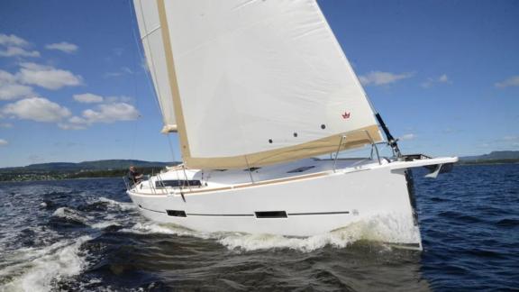 Sailing yacht Desiree II cruising swiftly on the open sea.