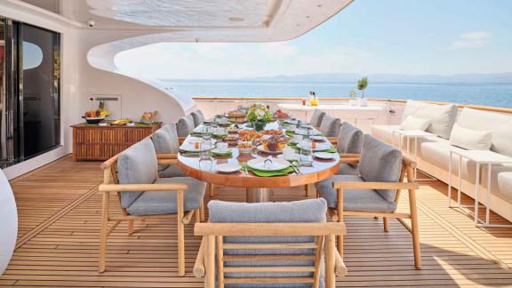 Lavishly set breakfast table on deck.