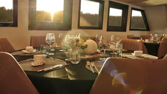 Romantic atmosphere in the yacht's dining room at sunset.