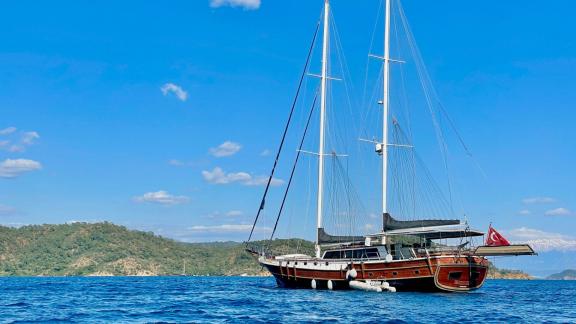 Gulet Diva Deniz with 6 cabins, anchored in calm blue waters near Marmaris.