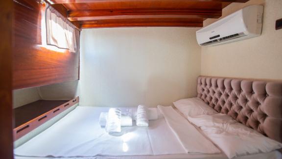 This cozy sleeping cabin on Gulet Hemera offers restful nights and comfort at sea.