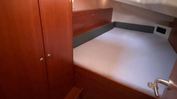 The spacious cabin with a double bed on Kia Ora yacht, simply decorated, offers a comfortable bareboat holiday.