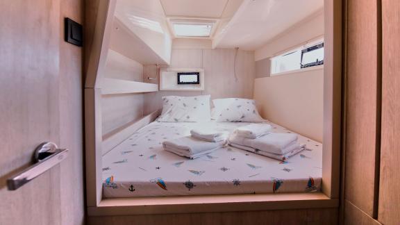 The double cabin on catamaran Derya offers a cozy sleeping area and windows that provide natural light.