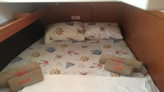 Another double cabin on the sailing yacht Santiago with maritime-themed bedding.