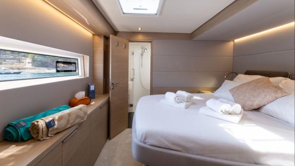 Lagoon 55 catamaran Artisan offers a bright and stylish master cabin for relaxing on board.