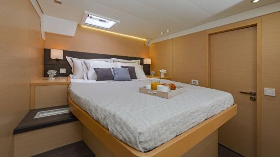 Comfortable guest cabin on the Lagoon 560 S2 Meliti with a double bed and stylish design