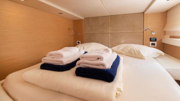 The bedroom of motor yacht Sabijac features a comfortable double bed.