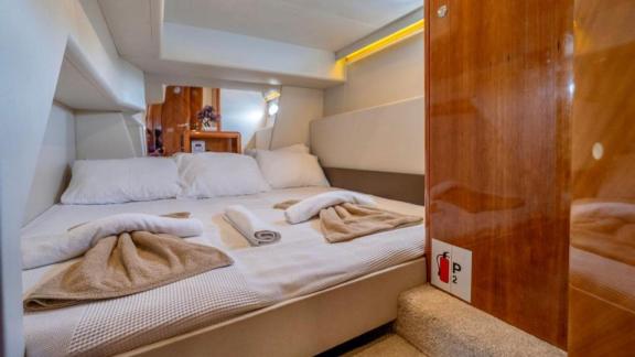 Cozy and stylish guest cabin of motor yacht Blue My Story.