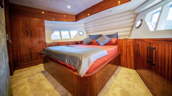 Cozy bedroom of motor yacht Imperial.