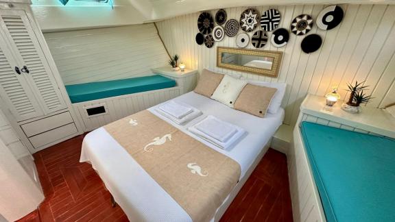 Relax in the comfortable cabin of Gulet Mandala, perfect for a peaceful night in Göcek.