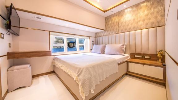 Comfortable cabin on the Floki trawler yacht, equipped with modern details.