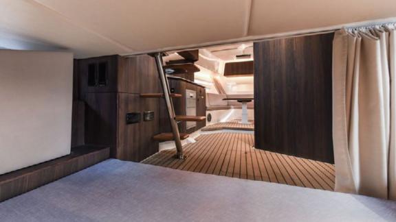 The Orix motor yacht’s interior features stylish stairs and spacious seating areas for comfort.