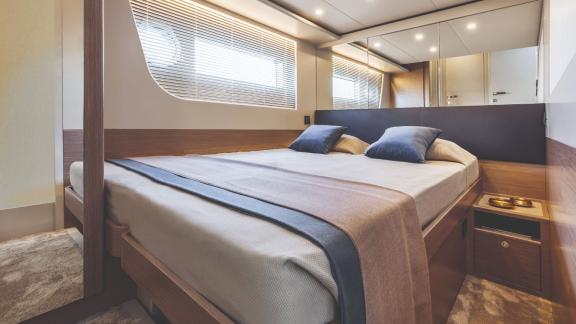 The elegant cabin of Emilia 2 is equipped with a large bed and comfortable details.