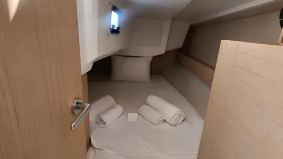 The double cabin of Lima yacht features a comfortable bed and pillows.