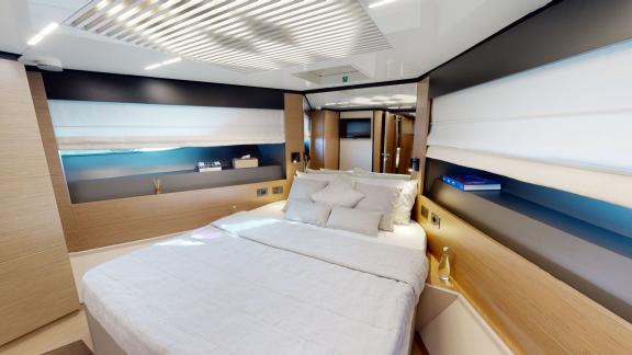 The spacious guest bedroom of the Ferretti 780 motor yacht adds comfort and elegance to your daily yacht rental in Dubai