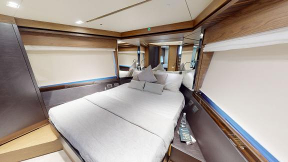 The guest cabin of the Ferretti 670 motor yacht adds comfort to your daily yacht rental experience in Dubai.