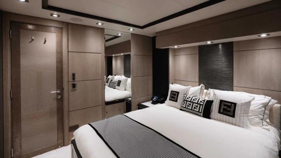 The modern bedroom on Ak Royalty yacht combines elegance and comfort seamlessly.