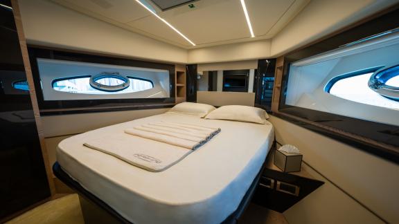 Relax in the modern and comfortable guest cabin of Pershing 70 with your daily yacht rental in Dubai.