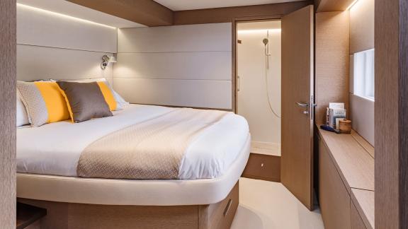 The luxurious cabin on the Catamaran Daiquiri features a large, comfortable bed and direct access to an elegant private 