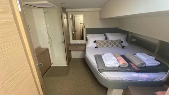 Allure catamaran for rent offers elegant cabins with en-suite bathroom comfort.