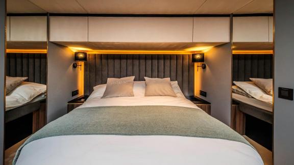 Featuring a plush headboard and ambient lighting, this cabin offers a luxurious charter stay in Split.