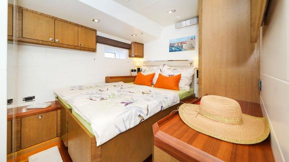 The sailing yacht Bellkara Conrad Shipyard YCC91 features a warmly styled guest cabin offering comfort and charm.
