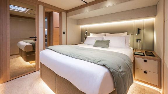Imladris offers this cozy suite with soft tones and a sleek design for a peaceful night at sea.