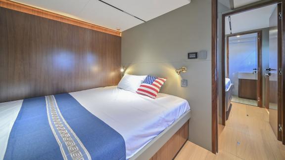 Evita power catamaran features a double bed, wooden interior and access to a private bathroom.