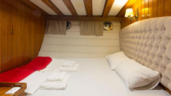 Comfortable and inviting cabin with double bed on board the Gulet Hera.